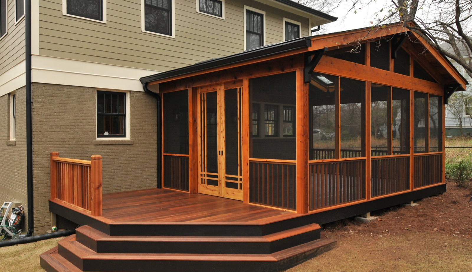 A carefree child enjoys pushing an empty stroller outside on a sunny day by patio chairs.